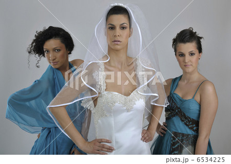 portrait of a three beautiful woman in wedding dress 6534225