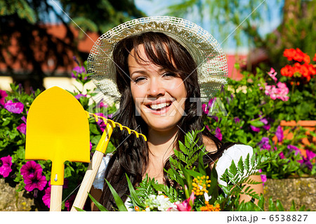Gardening in summer - woman with flowers Gardening in summer - woman with flowers 6538827