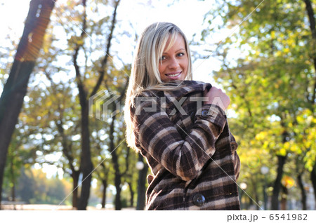 blonde Cute young woman smiling outdoors blonde Cute young woman smiling outdoors 6541982