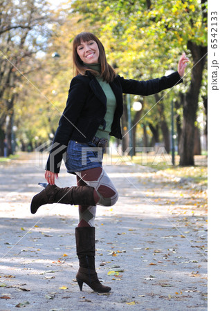 brunette Cute young woman smiling outdoors in nature brunette Cute young woman smiling outdoors in nature 6542133