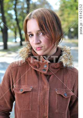 brunette Cute young woman with piercing posing outdoors 6542152