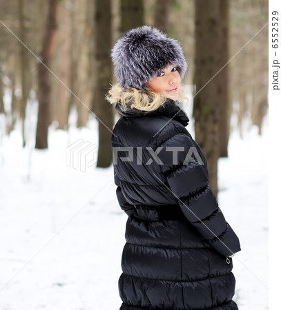 Beautiful lady in winter coat 6552529