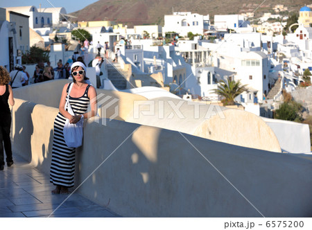 Greek woman on the streets of Oia, Santorini, Greece 6575200