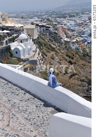 Greek woman on the streets of Oia, Santorini, Greece Greek woman on the streets of Oia, Santorini, Greece 6575205