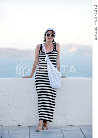 Greek woman on the streets of Oia, Santorini, Greece Greek woman on the streets of Oia, Santorini, Greece 6575232