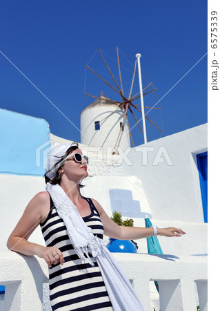 Greek woman on the streets of Oia, Santorini, Greece 6575339