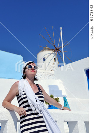 Greek woman on the streets of Oia, Santorini, Greece 6575342