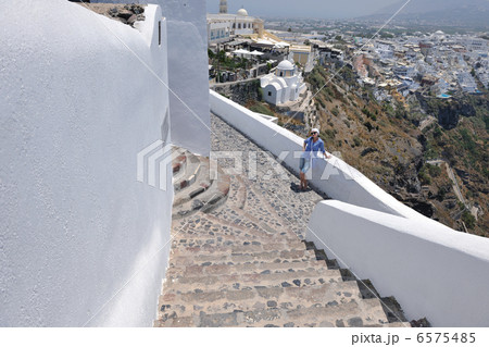 Greek woman on the streets of Oia, Santorini, Greece 6575485