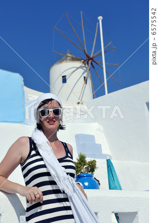 Greek woman on the streets of Oia, Santorini, Greece 6575542
