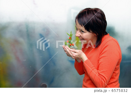 Beautiful girl holding young plant 6575832