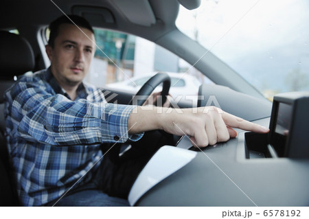 man using car navigation man using car navigation 6578192