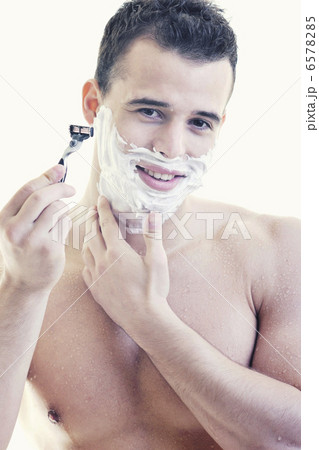 young man shaving young man shaving 6578285