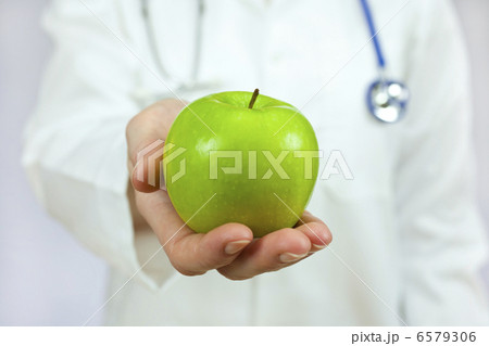 Doctor Holding Green Apple Doctor Holding Green Apple 6579306