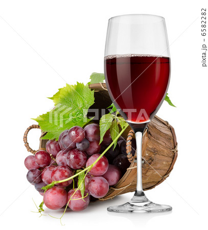 Wineglass and  grapes in a basket 6582282
