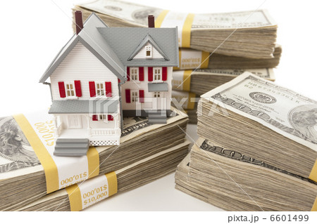 Stacks of Hundreds of Dollars with Small House Stacks of Hundreds of Dollars with Small House 6601499