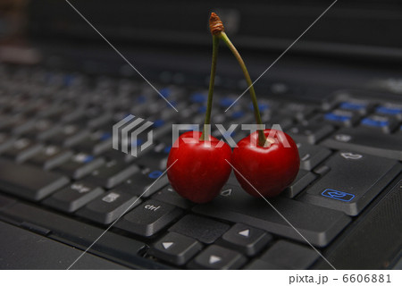 fresh cherry on laptop keyboard 6606881