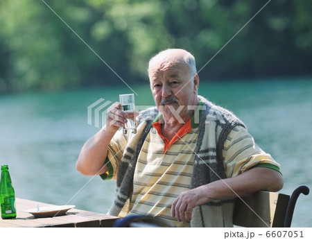 senior man eat desser at outdoor restaurant senior man eat desser at outdoor restaurant 6607051