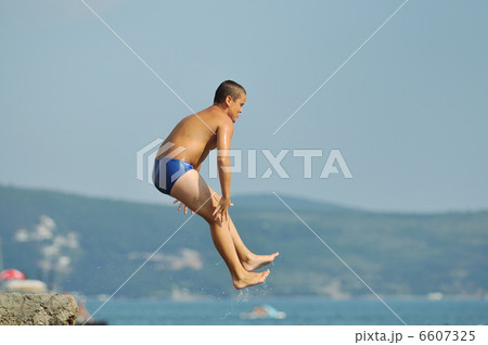 boy jump sea boy jump sea 6607325