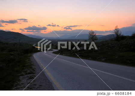 countryroad adventure with beautiful sunset 6608184
