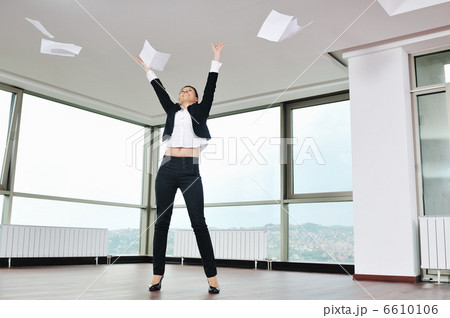 young business woman throw papers in air 6610106