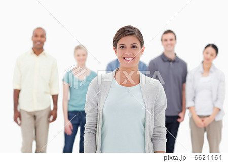 Close-up of a woman smiling with people behind her 6624464