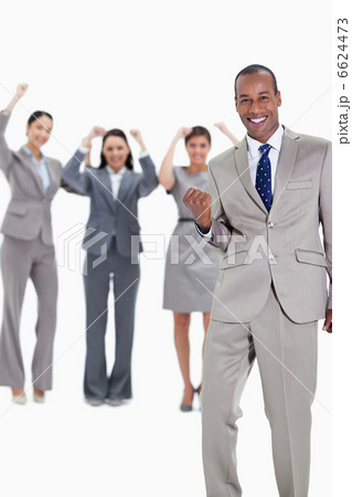 Successful business team with a happy businessman in foreground Successful business team with a happy businessman in foreground 6624473