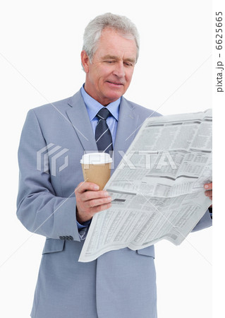 Mature tradesman with news paper and paper cup Mature tradesman with news paper and paper cup 6625665
