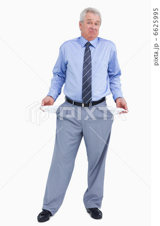 Clueless mature tradesman showing his empty pockets 6625995
