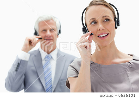 Close-up of a woman talking and wearing a headset with a white h 6626101