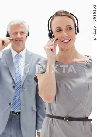 Close-up of a woman wearing a headset with a white hair business 6626103