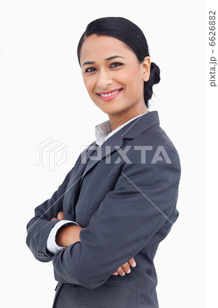 Close up of smiling saleswoman with arms crossed Close up of smiling saleswoman with arms crossed 6626882