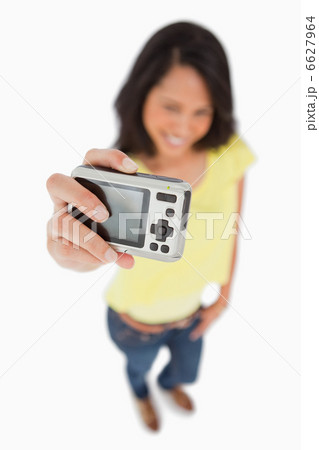 Young woman taking a picture of herself Young woman taking a picture of herself 6627964