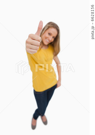 Portrait of a blonde woman the the thumb-up Portrait of a blonde woman the the thumb-up 6628156