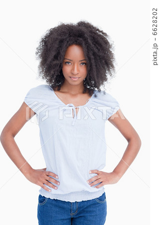 Serious woman placing her hands on her hips Serious woman placing her hands on her hips 6628202