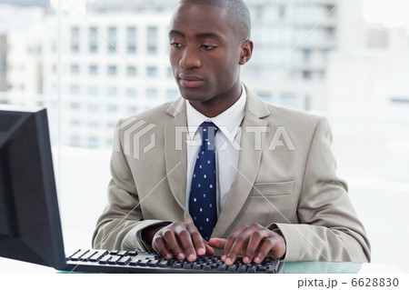 Office worker using a computer Office worker using a computer 6628830