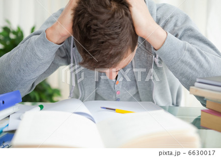 Student tearing his hair Student tearing his hair 6630017