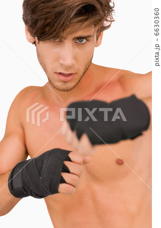 Male martial arts fighter in fighting pose Male martial arts fighter in fighting pose 6630360
