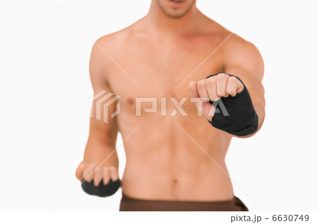 Martial arts fighter doing his exercises Martial arts fighter doing his exercises 6630749
