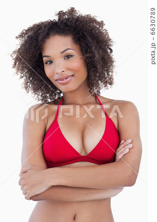 Smiling woman standing with arms crossed Smiling woman standing with arms crossed 6630789