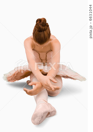 Sitting ballerina doing stretches 6631044