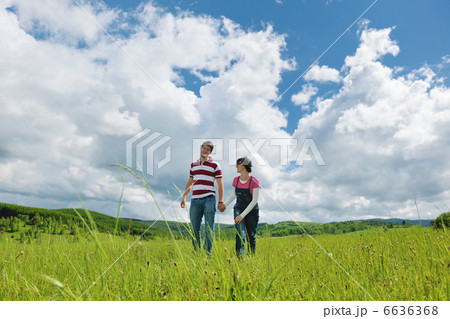 Portrait of romantic young couple smiling together outdoor 6636368