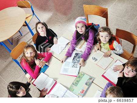 happy kids with teacher in school classroom 6639857