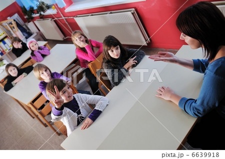 happy teacher in school classroom 6639918