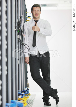 young engeneer in datacenter server room young engeneer in datacenter server room 6640569