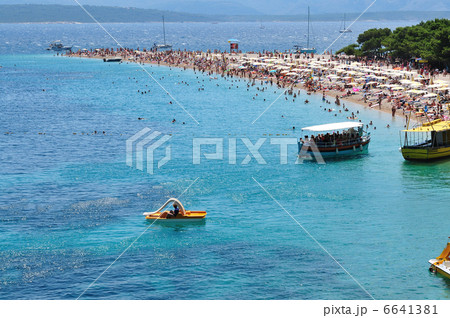 people relaxing on beach 6641381