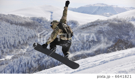 freestyle snowboarder jump and ride freestyle snowboarder jump and ride 6641821