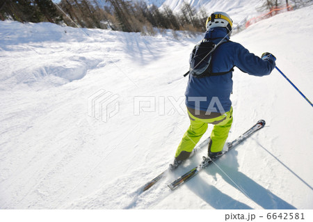 skiing on fresh snow at winter season at beautiful sunny day 6642581