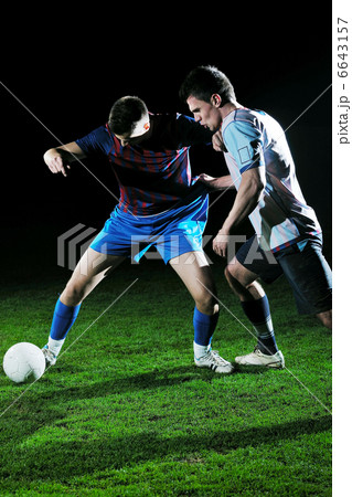 football players in competition for the ball football players in competition for the ball 6643157