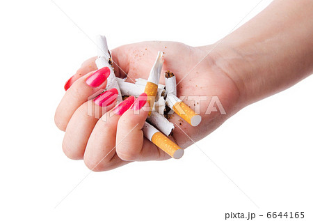 Antismoking concept with cigarettes and hand 6644165