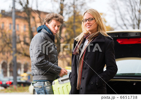 Young woman in front of taxi 6651738